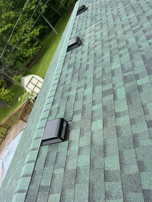 Ridge vent installation for proper attic ventilation by Lincoln Park Roofing